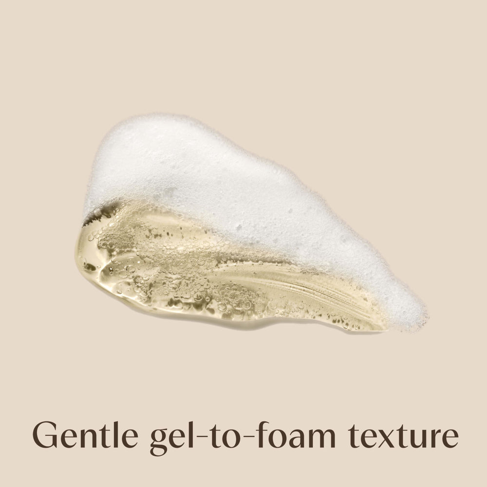 Aveeno creamy foam lather in hand for effective, gentle cleansing
