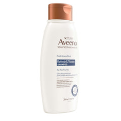 Aveeno shampoo in hand during application showing easy dispensing and spread