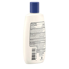 Aveeno lotion spread on forearm to show reduced redness and soothing