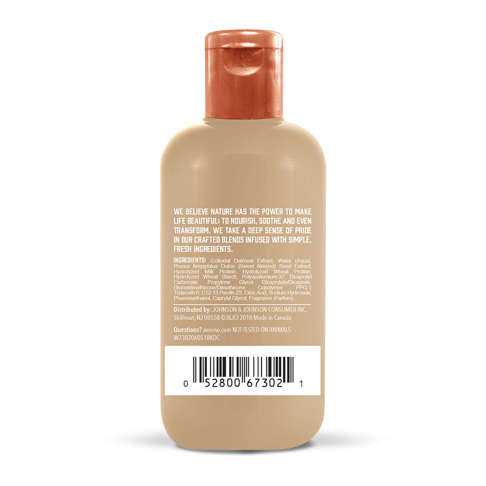 Aveeno oat milk texture pouring to show lightweight, creamy leave-in treatment