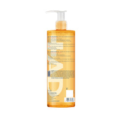 Avène XeraCalm AD bottle in hand for scale to show practical size for family use