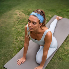 Awumbuk side profile worn during yoga showing secure no-slip fit benefit