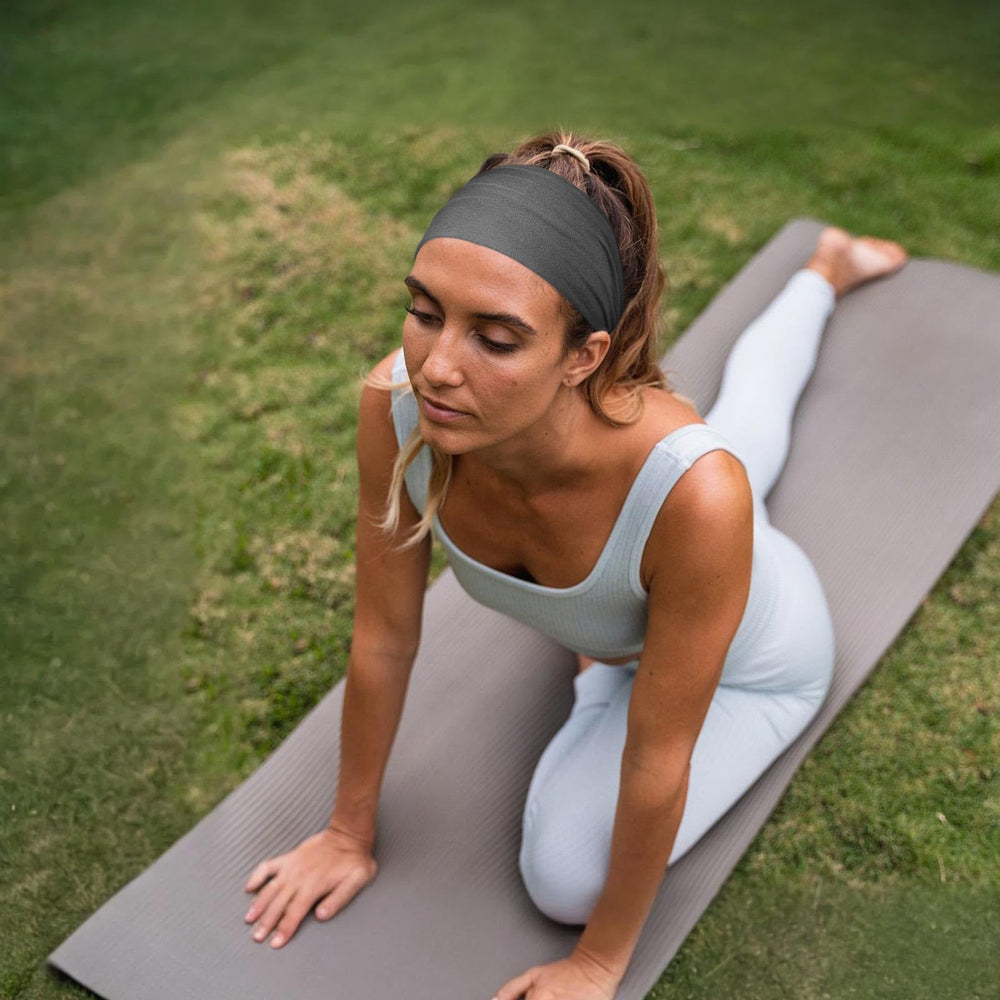 Awumbuk worn during yoga demonstrating secure fit and sweat control