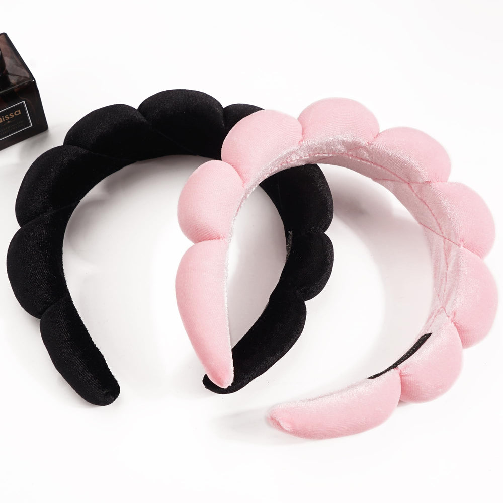 Ayesha headband shown on hand for size comparison indicating one-size fit