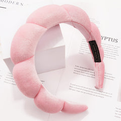 Ayesha headband worn during face wash showing secure hold and clear facial access