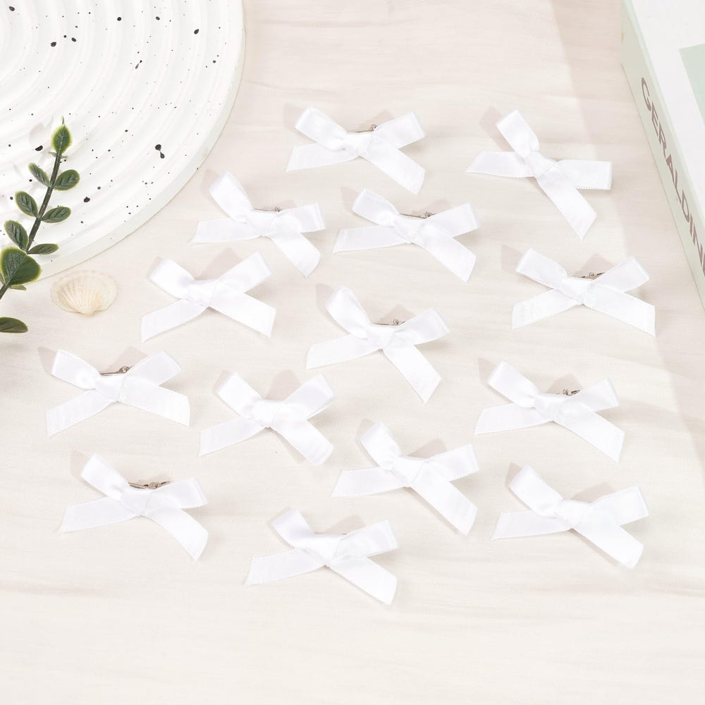 Ayesha bow size comparison in hand to show compact 2-inch scale