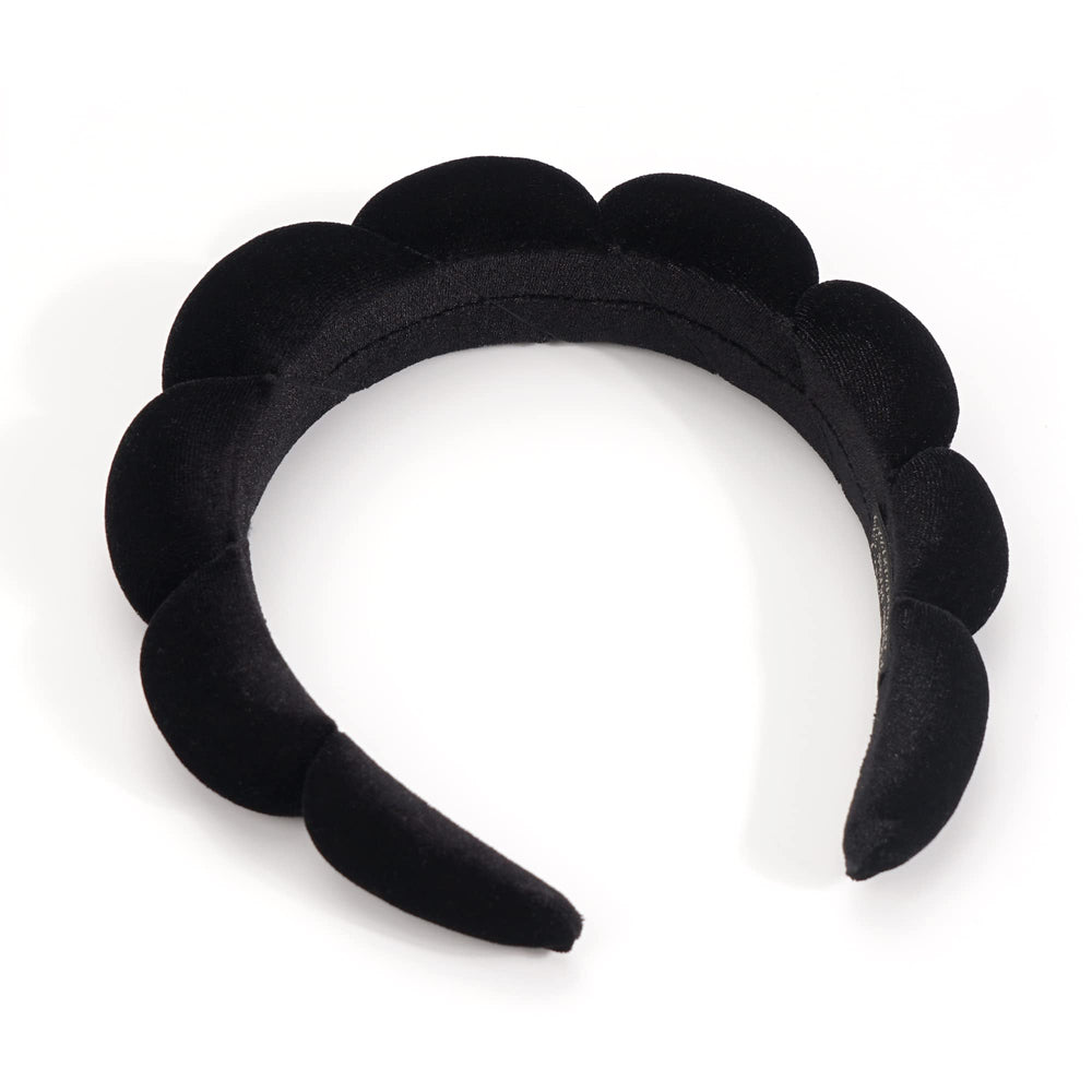 Ayesha headband held in hand demonstrating size and lightweight portability benefit