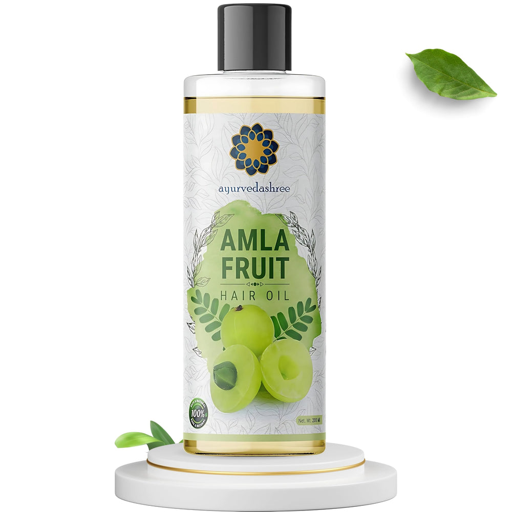 AYURVEDASHREE oil pour close-up highlighting silky texture and nourishment
