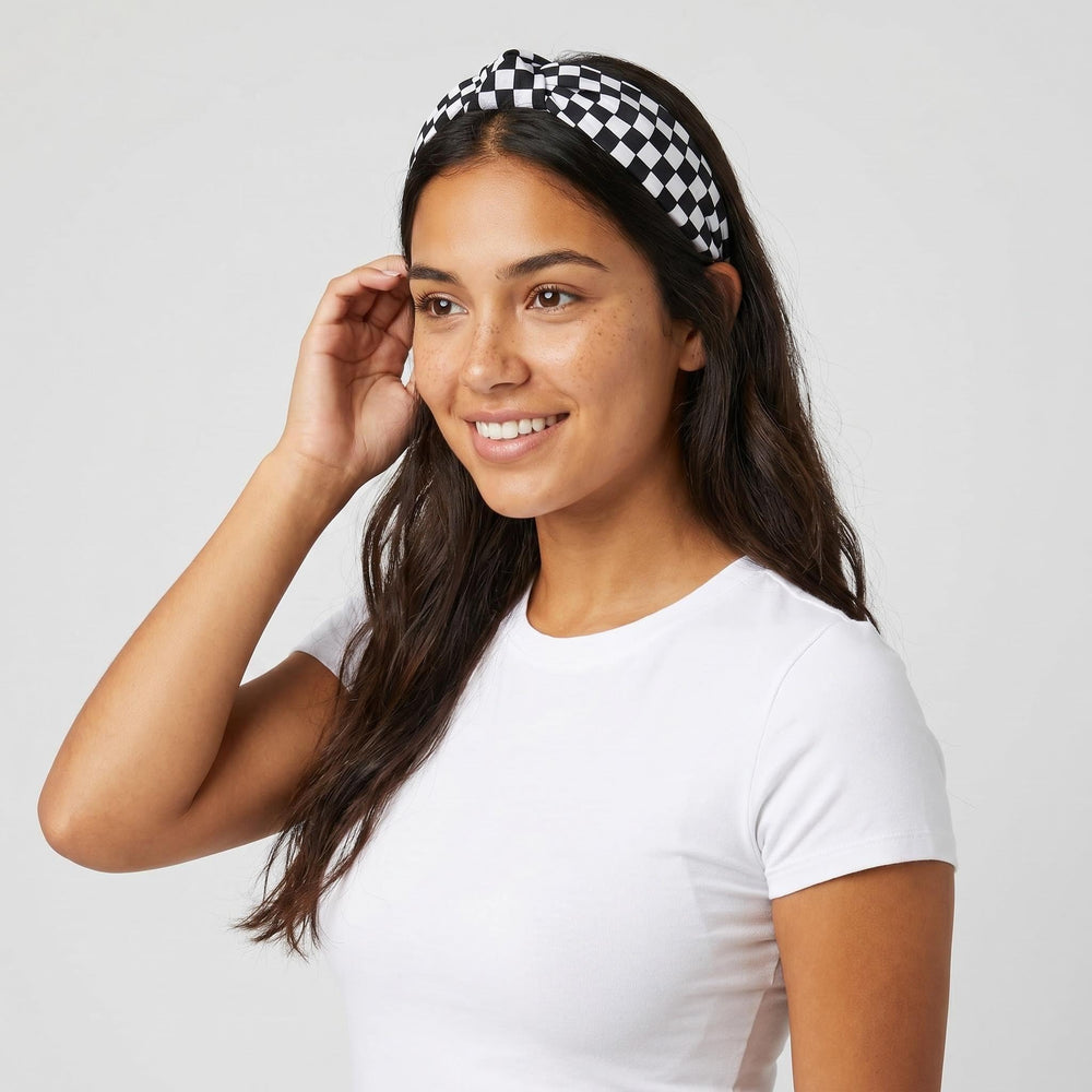 BaBakiak headband held in hand illustrating size and stretch fit