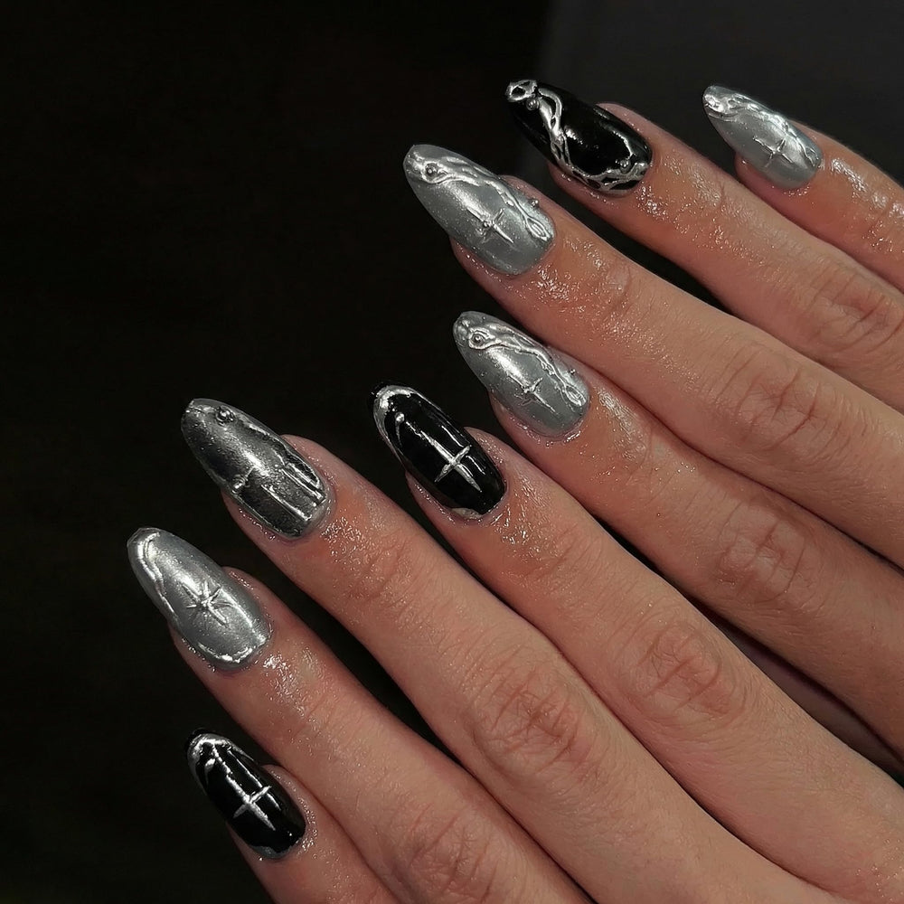 BABALAL front view of medium almond nails highlighting black cat-eye design benefit