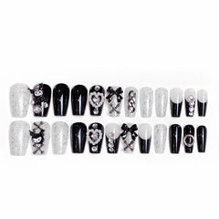 BABALAL nails on hand for scale illustrating medium coffin length and fit