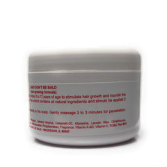 Baby Don't Be Bald 8 oz bottle held in hand to show scale, convenient for daily home use