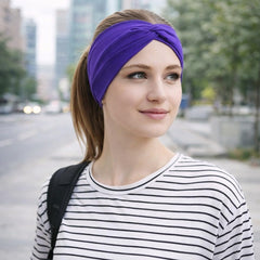 BABYGIZ headband worn in yoga studio demonstrating sweat‑resistant fit benefit