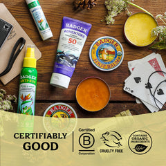 Badger 2 oz tin beside common items for size comparison and easy portability