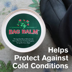 Applying Bag Balm to dry hands demonstrating brand restoring skin softness