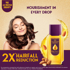 Golden almond oil texture from Bajaj Almond Drops demonstrating lightweight absorption