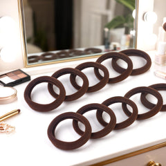 BAOLI hair tie beside a hand showing diameter and strong-stretch benefit