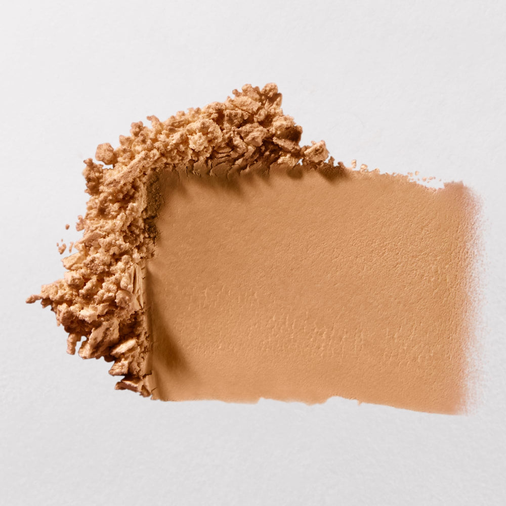 bareMinerals brush applying powder to face demonstrating matte, lasting finish