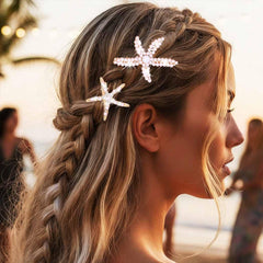 BARTOSI clips worn in beach waves adding shimmer and seaside charm