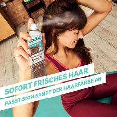 Batiste color tint close-up blending into brunette hair for natural finish