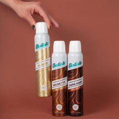Batiste tucked inside a toiletry bag depicting convenience for on-the-go refresh
