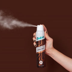 Batiste next to travel essentials showing 200ml size and portability benefit