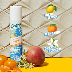 Batiste being sprayed at roots to instantly add volume and texture