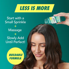 Batiste bottle in hand showing compact TSA-compliant portability
