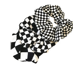 BBTDIN close-up showing fabric texture and checkerboard pattern, gentle hold