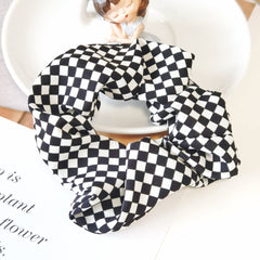 BBTDIN lifestyle flatlay pairing scrunchies with outfit, versatile styling option