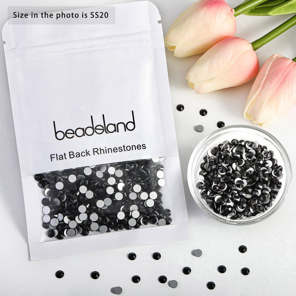 BEADSLAND hand holding a 10mm rhinestone to show scale and easy handling for projects