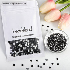 BEADSLAND hand holding a 10mm rhinestone to show scale and easy handling for projects