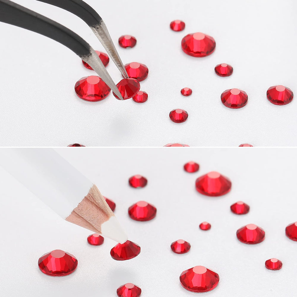 BEADSLAND tweezers and wax pencil positioned with gems for precise placement