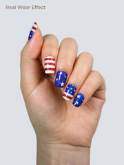 Beaolata finished manicure hand displaying stars and stripes design for festive look benefit