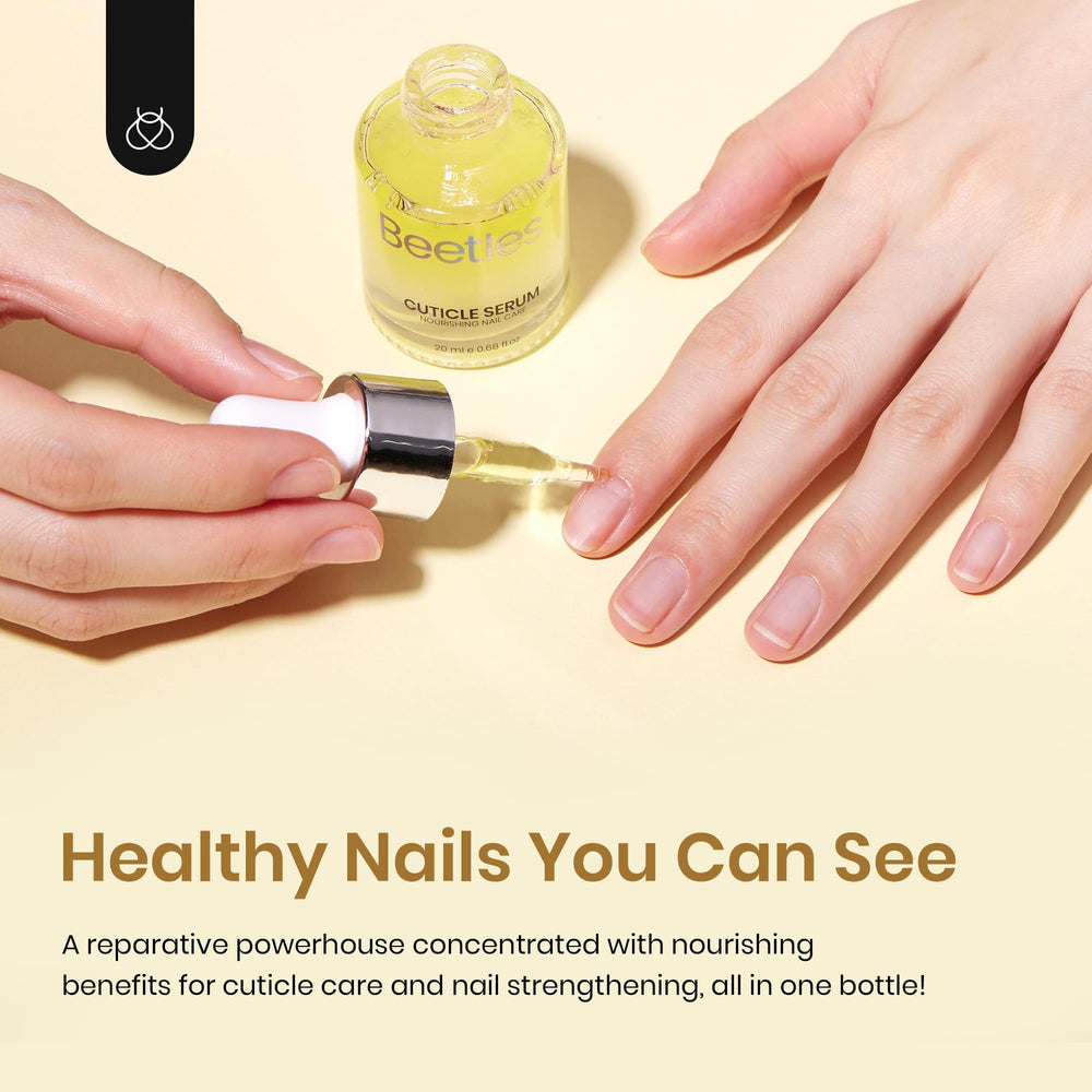 beetles application on hand massaging oil for softer cuticles