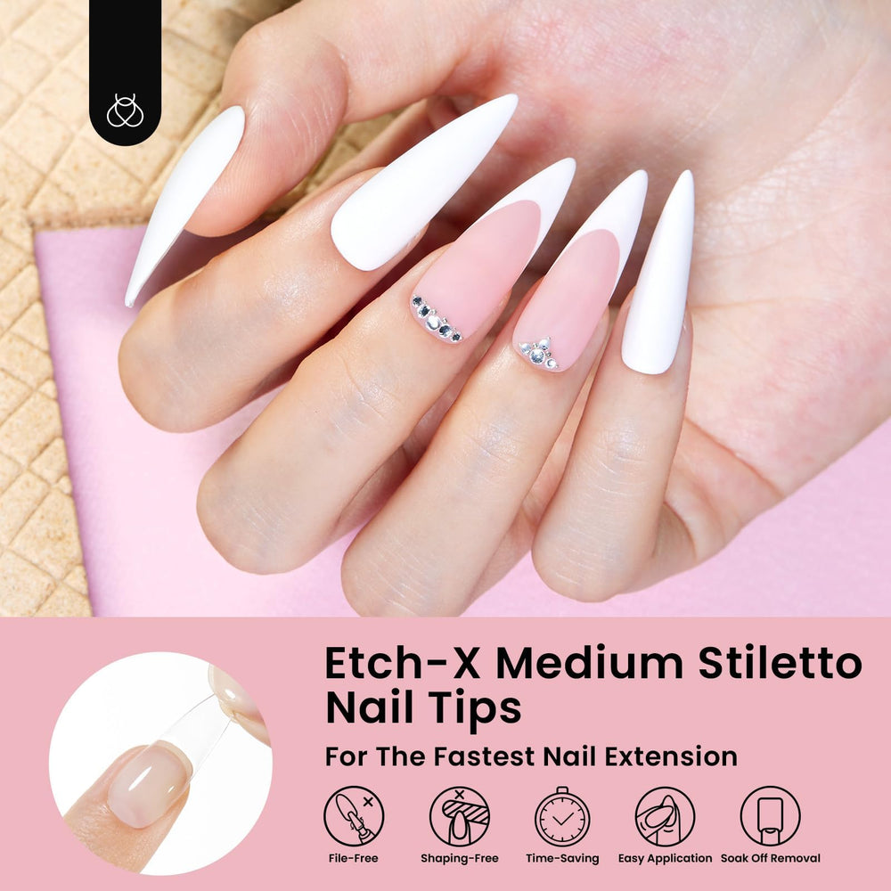 beetles hands applying tip during press-on routine for fast manicure
