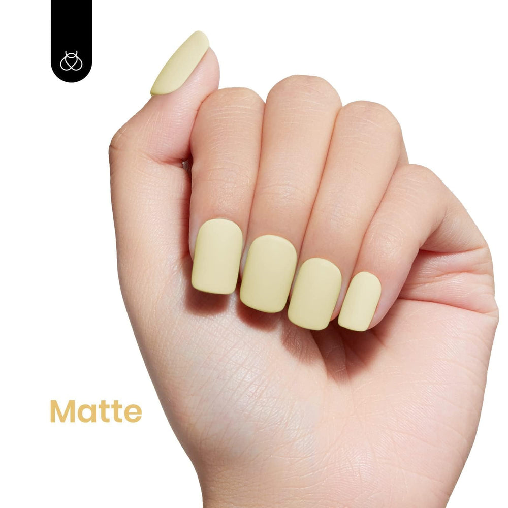 Beetles 15ml bottle next to ruler showing compact salon-ready size for multiple uses