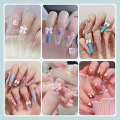 BELLEBOOST nails with bows and pearls in use showing finished salon-style result