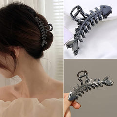 BELSITA clip held in hand to show size and portability