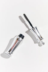Benefit Brow Setter travel-size next to coin for scale showing compact portability benefit