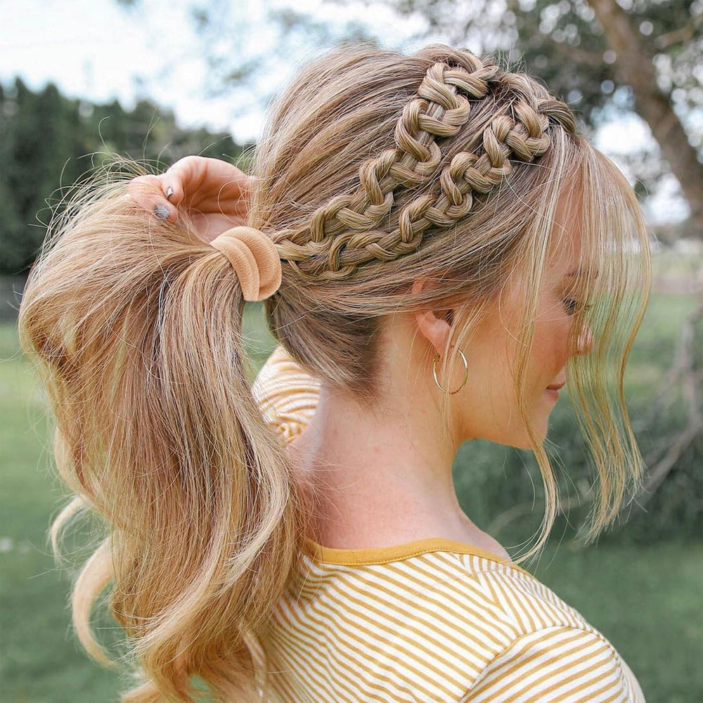 Bessrung used to secure a high ponytail showing a neat, crease-free style