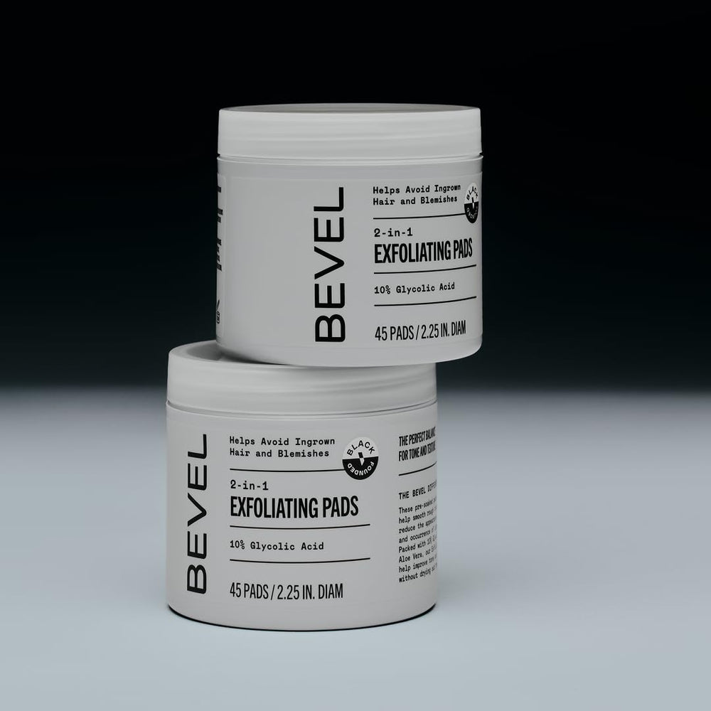Bevel pad in hand applying to cheek to reduce ingrown hairs and bumps