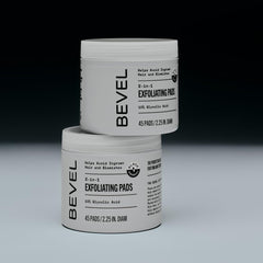 Bevel pad in hand applying to cheek to reduce ingrown hairs and bumps