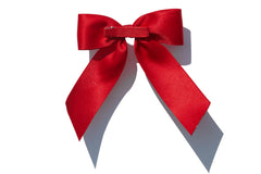 BHEXOV bow clipped in a ponytail demonstrating a secure, polished look