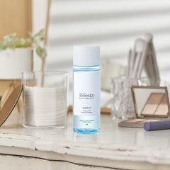 Bifesta on bathroom vanity next to skincare indicating daily-night routine benefit