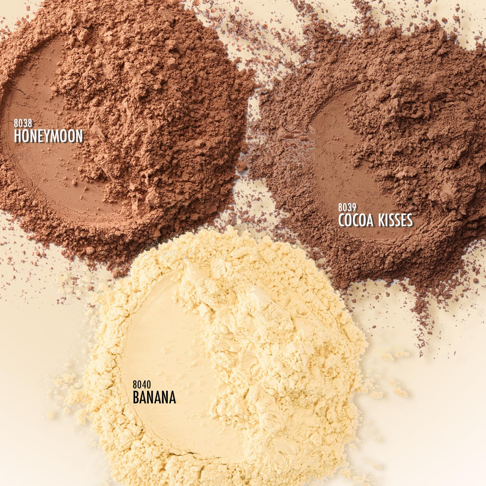 Applying Black Radiance powder with brush for lasting makeup and oil control