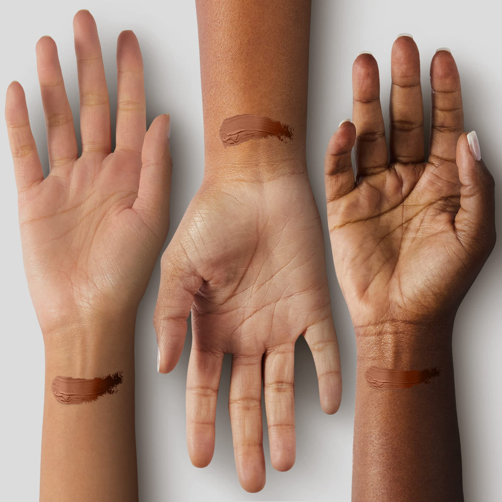 Black Radiance swatch on arm showcasing pigment-rich texture for true-to-skin color