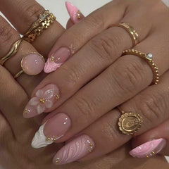 Bloazife close-up of pink 3D floral detail on nail, highlights textured decorative accent