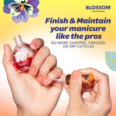 Blossom bottle held in hand to show compact 0.5 fl oz travel-friendly size