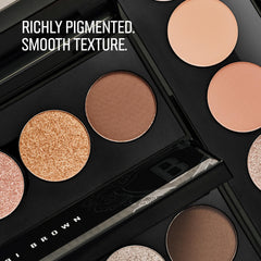 Bobbi Brown brush applying metallic shade to lid demonstrating quick dimension boost
